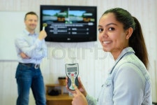 Driving student holding remote control | Stock image | Colourbox