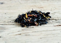 Dried tea leaves on wooden surface | Stock image | Colourbox