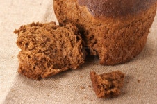 Broken rye bread on canvas. | Stock image | Colourbox