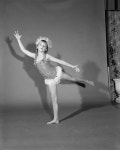 [Girl in dance attire posing in a studio with her hair in pigtails] - UNT Digital Library [Girl in dance attire posing in a...