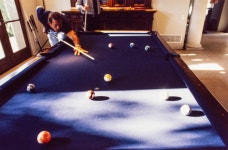 [Mike Modano playing pool with a family member] - UNT Digital Library [Mike Modano playing pool with a family member]