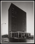 [A skyscraper next to a parking lot and a street] - UNT Digital Library [A skyscraper next to a parking lot and a street]