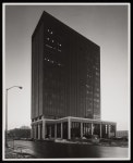 [A skyscraper next to a parking lot and a street] - UNT Digital Library [A skyscraper next to a parking lot and a street]