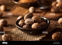 Raw Organic Dry Nutmeg to Use as a Spice Stock Photo - Alamy