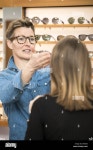 friendly service at the optometry Stock Photo - Alamy