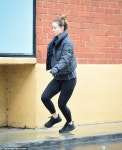 Olivia Wilde LEAPS over a puddle after hitting the gym | Daily Mail Online Olivia Wilde LEAPS over a puddle after hitting the gym