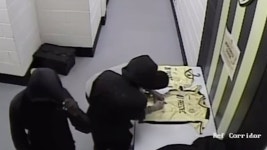 Remarkable CCTV footage shows masked thieves breaking into a football club and adding THEIR SIGNATURES to signed shirts before... 
