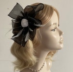 A BLACK and WHITE FASCINATOR Made With Organza Feathers - Etsy