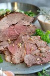 Instant Pot Leg of Lamb Sliced lamb roast on a grey plate with parsley. in 2024 | Low carb slow cooker, Keto recipes, Instant pot... 