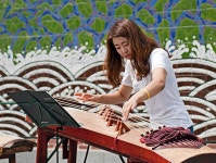 Korean lady playing the 가야금 (gayageum) in Insadong, a stringed instrument that goes back to the 6th century. — at Insadong... 
