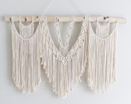 Treat yourself to a striking piece of handwoven art with the Savannah macrame wall hanging. The intricate center weave and softly... 