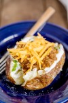 Taco Stuffed Baked Potatoes - A perfect baked potato stuffed with spicy taco meat and topped with cheese, … | Stuffed baked... 