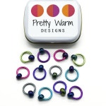 multi coloured anodized aluminum rings with blue beads stitch markers with tin for knitting by Pretty Warm Designs | 악세사리