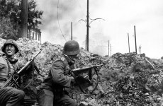 Two German soldiers, armed with MP 40 submachine guns, in combat against Soviet troops outside Stalingrad, 1942 | 2차 세계대전... 