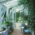 of furniture and plants set the tone for this small area! It gives new meaning to letting the outdoors… | 온실, 인테리어, 정원