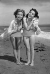 Jane Powell and Elizabeth Taylor at the beach during a photo...