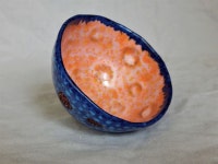 Blue and orange teacup with stamped floral motifs. . . . #pottersofinstagram #instapottary #pottery #ceramic #clay #ceramicart... 