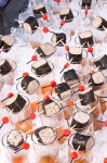 Rice and nori sushi rolls are beautifully displayed by red and black toothpicks. | 요리, 사시 미