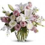 Isnt It Romantic Tonight will certainly be romantic if you send this classic arrangement today! Beautiful hues and gorgeous blossoms... 