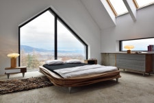 The organique bed is part of collection by Polish design brand Gie El which share a similar unique aesthetic of wavy, layered, natural wood... 