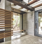A blown-glass light fixture by Bocci in the entry foyer produces a glow when viewed from outside at night. With a copper wire that... 