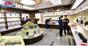 룡봉학용품공장에서 - At Ryongbong School Supplies Factory -