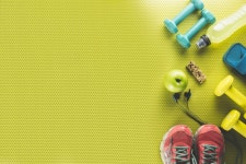 Apple and energy bar near sports stuff  Photo | Free Download