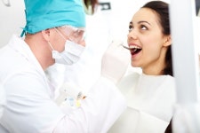 Dentist examining patients teeth  Photo | Free Download