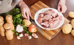 Hands with meat and potatoes  Photo | Free Download