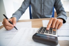 Man income analyzing pushing button  Photo | Free Download