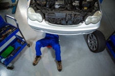 Mechanic repairing a car  Photo | Free Download