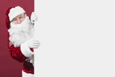 Santa Claus looking out of white wall  Photo | Free Download