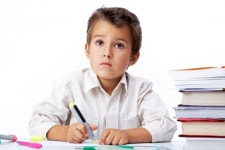 Schoolboy painting with a highlighter  Photo | Free Download