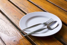 Spoon and fork on a plate  Photo | Free Download