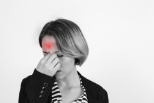 Woman with headache in studio  Photo | Free Download
