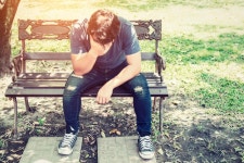 Worried man sitting on a bench  Photo | Free Download