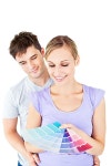 유토이미지 | Enamored couple choosing color for a room