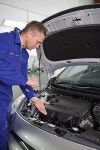 유토이미지 | Mechanic showing an engine