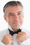 유토이미지 | Happy man adjusting his bow tie