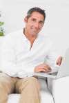 유토이미지 | Cheerful man typing on the laptop 유토이미지 | Cheerful man typing on the laptop 