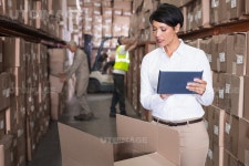 유토이미지 | Pretty warehouse manager using tablet pc