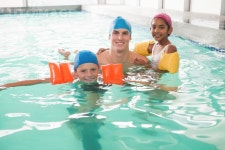 유토이미지 | Cute swimming class in pool with coach