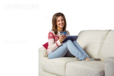 유토이미지 | Festive brunette shopping online with tablet pc