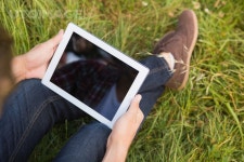 유토이미지 | Man with tablet pc in park on a sunny day