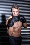 유토이미지 | Portrait of serious muscular boxer in crossfit gym