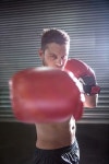 유토이미지 | Portrait of serious muscular boxer in crossfit gym
