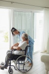 유토이미지 | Front view of senior Caucasian man sitting on the bed while reading through the prescription. Authentic Senior... 