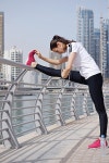 유토이미지 | Young beautiful woman jogging and running on morning at park in the city. Woman in sport outdoors health and... 
