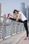 유토이미지 | Young beautiful woman jogging and running on morning at park in the city. Woman in sport outdoors health and... 