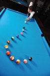 유토이미지 | young pro billiard player finding best solution and right angle at billard or snooker pool sport game... 